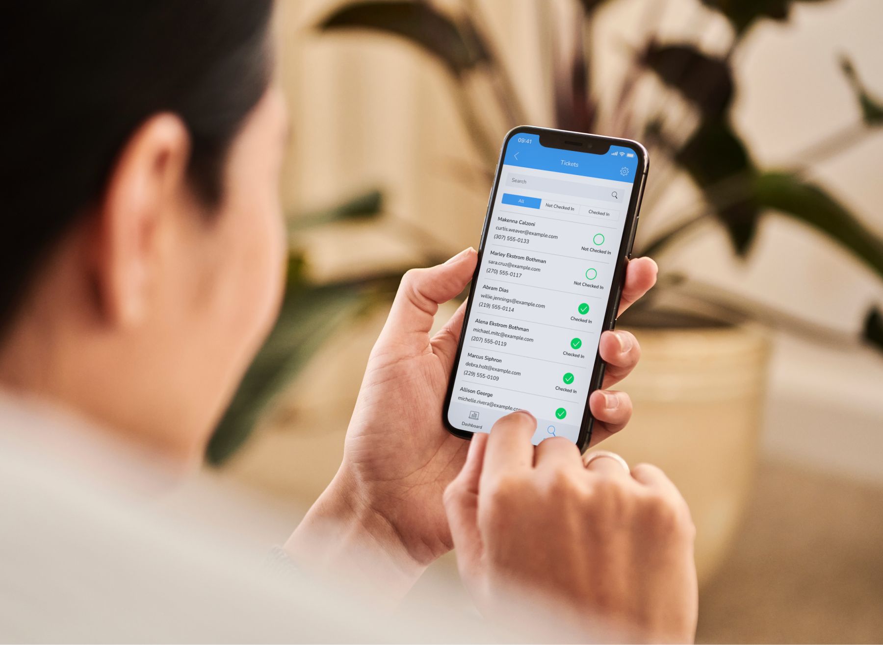 man holding a phone with a banking app