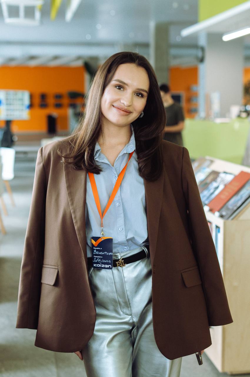 A female figure standing in the office